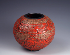 14. Large thrown red & bronzed volcanic bottle.