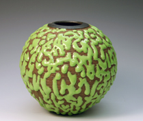 27. Thrown bottle with striated surface and copper green globular crawing glaze.
