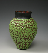 20. Lush green crawling glaze over a thrown vessel with red interior.