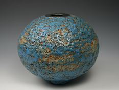 23. Volcanic blue and bronze bottle form.