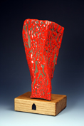 3. Assembled and carved obelisk with red crawling stoneware glaze mounted on oak base