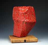 4. Assembled and carved block sculpture with red crawling stoneware glaze mounted on oak base