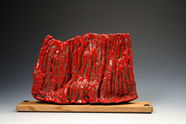 1. Assembled and carved sculpture with red crawling stoneware glaze mounted on oak base