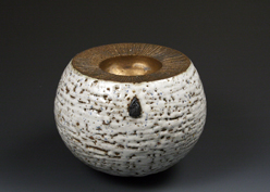 7. Thrown and assembled double walled bowl with white crawling glaze and bronzed upper