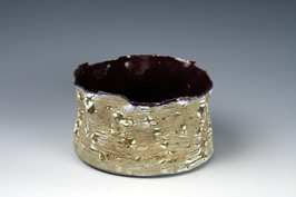 28. Reticulated cobalt and manganese glazed dish with purple interior.