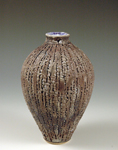 35. Multiple fired textured thrown vessel.