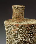 30. Large assembled bottle with heavily crawling reticulated glaze.