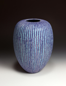 36. Blue and pink vessel with vertical stripes