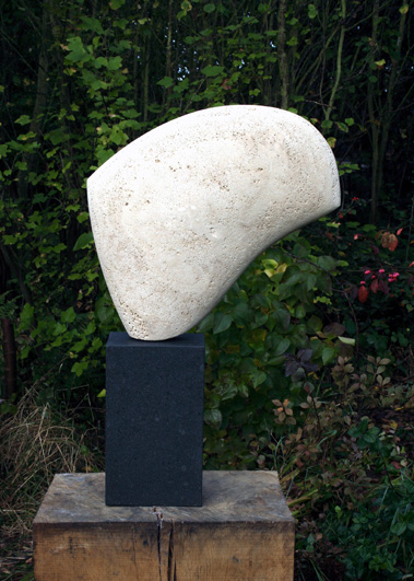 Sail form, Travertine on bursting stone base 77cm h inc base