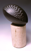 12. Head form (view 1).  Dry rigg stone, base travatine. 45cm high