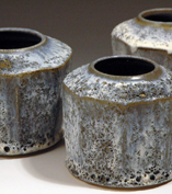 44. Hexagonal jars with vocanic exterior.   10cm to 15cm H.